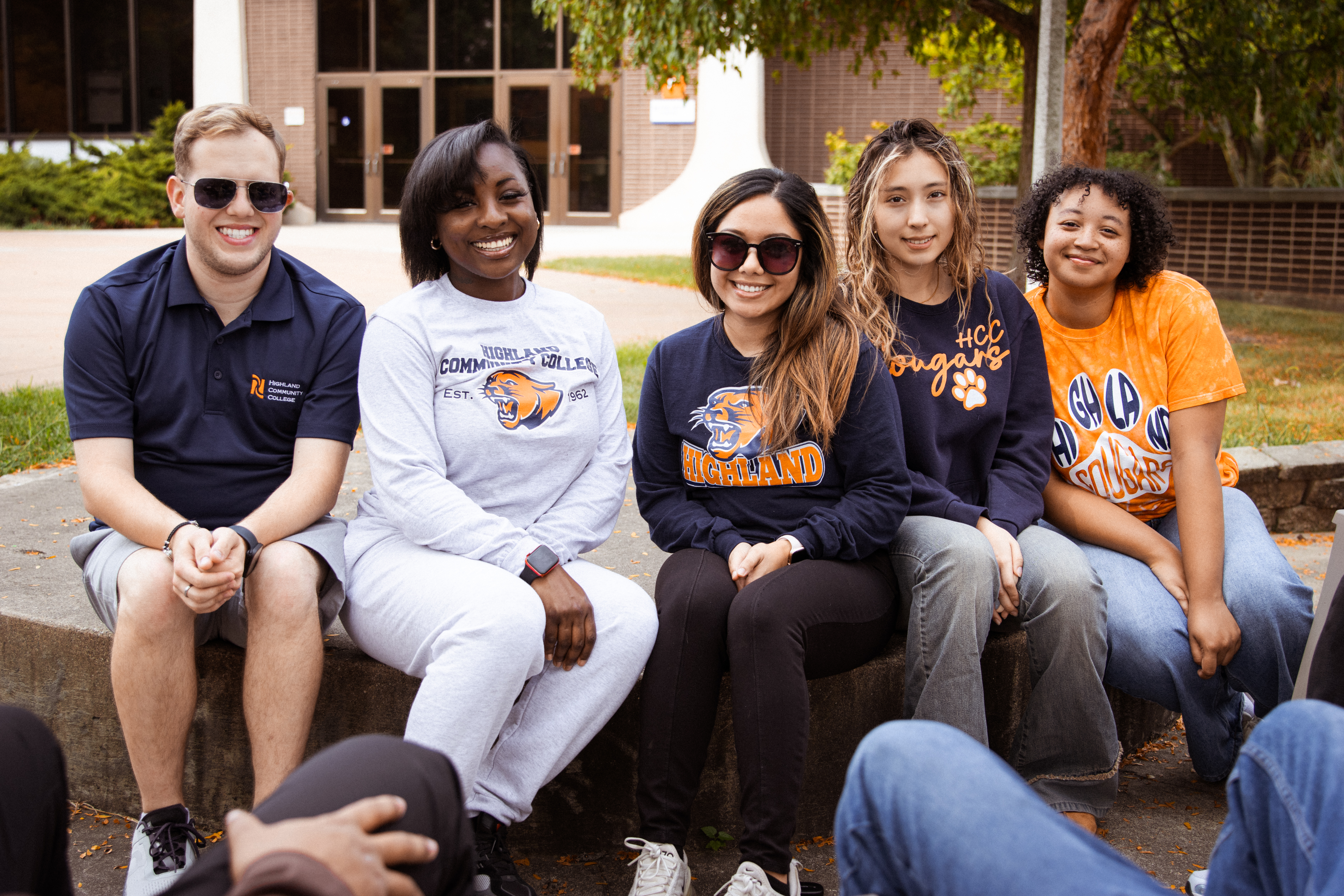 Smiling graduates in caps and gowns